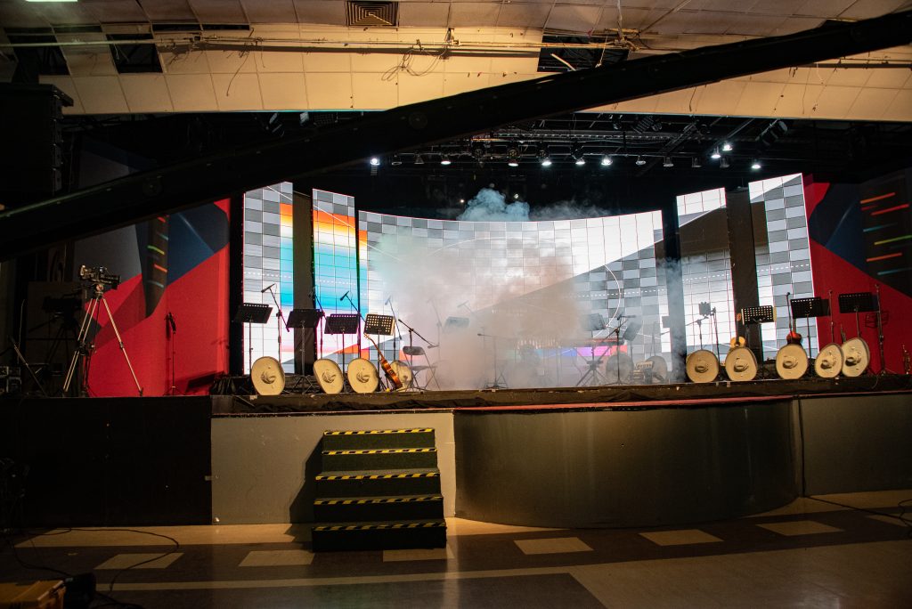 mariachi musical stage with lights, hats and instruments ready for performance